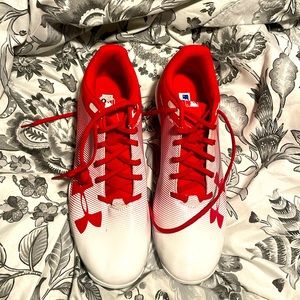 Brand new never used red and white under armour cleats size 9.5 men